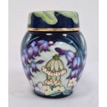 Moorcroft miniature enamel vase and cover, allover decoration of spring flowers including