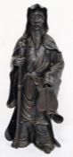 Chinese bronze standing figure of bearded man holding a staff and bamboo fan, 30cm high