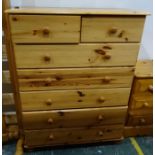 Modern pine chest of two short over five long drawers, a pair of pine bedside chests and a pine
