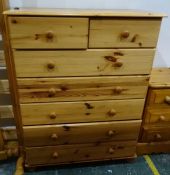 Modern pine chest of two short over five long drawers, a pair of pine bedside chests and a pine