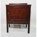 Early 20th century oak single door pot cupboard on square section supports, 62cm x 76cm