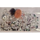 Bag of loose mixed stones including cubic zirconia, ruby, sapphire, emerald and other gemstones,