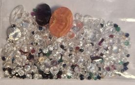 Bag of loose mixed stones including cubic zirconia, ruby, sapphire, emerald and other gemstones,