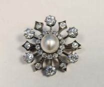 Early 20th century pearl and diamond target brooch, the central pearl (approx. 9mm diameter,