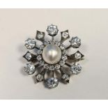 Early 20th century pearl and diamond target brooch, the central pearl (approx. 9mm diameter,