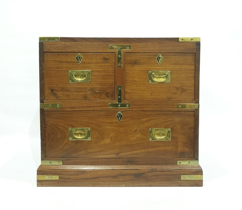 20th century mahogany campaign miniature chest of two short over one long drawer, plinth base, brass