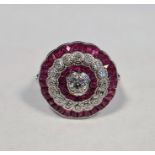 Large platinum ruby and diamond target ring, the central old-cut diamond (estimated weight 0.3ct,