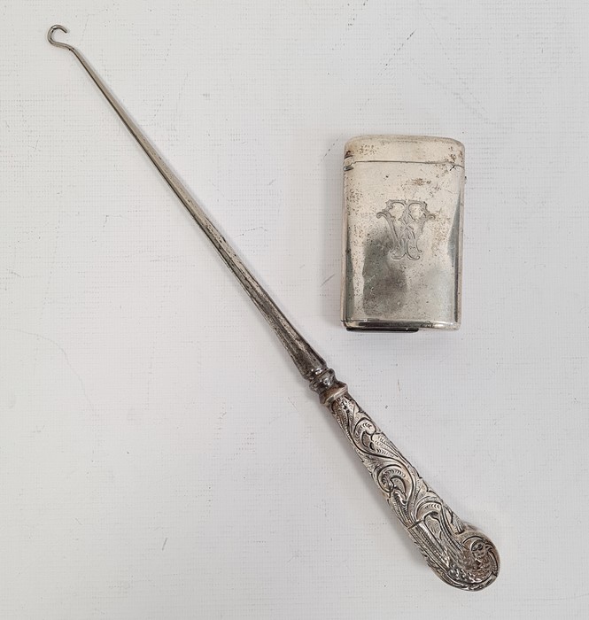 Victorian silver-handled button hook with foliate scroll decoration and an antique silver-plated