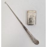 Victorian silver-handled button hook with foliate scroll decoration and an antique silver-plated