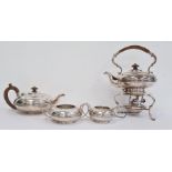 George V silver tea set, each piece oblate with reeded band, the teapot with pearwood finial and