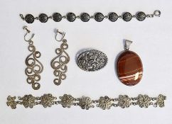 Silver-mounted banded agate pendant, oval, a silver pierced foliate scroll brooch, a silver disc