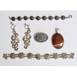 Silver-mounted banded agate pendant, oval, a silver pierced foliate scroll brooch, a silver disc