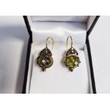 Pair of drop earrings set with cabochon peridot and diamonds, boxed