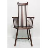 Circa 1920's stickback armchair, possibly J S Henry of London with carved top rail, stick back and