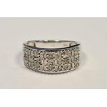 Diamond and silver pave set ring set variously rectangular cut stones