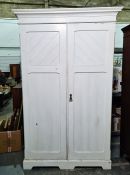 White painted two-door compactum wardrobe with ogee moulded pediment, two panelled doors enclosing