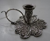 Georgian silver chamber taperstick with floral and foliate chasing within scrolls, scroll handle,