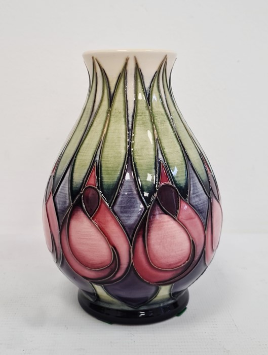 Moorcroft vase with pink and blue flowers with green leaves, cream ground, baluster form, dated