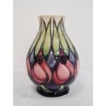 Moorcroft vase with pink and blue flowers with green leaves, cream ground, baluster form, dated