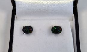 Pair of  black Ethiopian opal studs, boxedCondition ReportThe white metal is 925 silver. There is