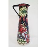 Moorcroft ewer ‘Red Ribbons’ pattern, black ground with pink flowers, green leaves, signed ‘