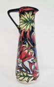 Moorcroft ewer ‘Red Ribbons’ pattern, black ground with pink flowers, green leaves, signed ‘