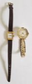 Lady's 18K gold wristwatch with rectangular dial, side button and 750 mark to reverse, leather strap