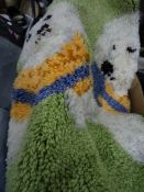 Quantity of shag pile bath and hearth mats and a quantity of knitting items in a fabric bag (2)