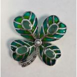 Four leaf clover brooch set with emeralds, seed pearl and marcasites and inlaid with enamel