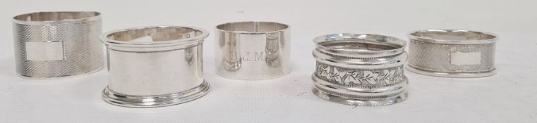 Five assorted silver napkin rings, various dates and makers to include Emile Viner, Sheffield,