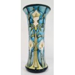 William Moorcroft vase in cream, blue and greens with flared rim, marked ‘Moorcroft’ to base and