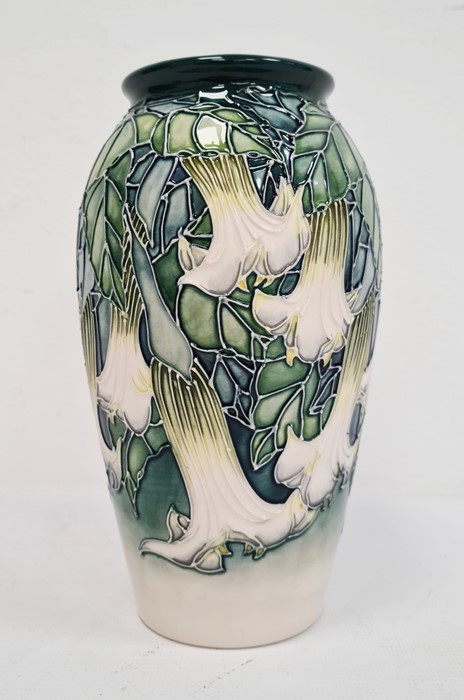 Moorcroft pottery vase, tall ovoid and decorated with white fuchsia on a blue and cream ground,