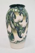 Moorcroft pottery vase, tall ovoid and decorated with white fuchsia on a blue and cream ground,