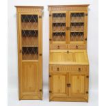 Modern light oak bureau bookcase, the moulded pediment above leaded glazed doors enclosing