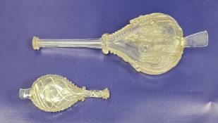 Two variously sized antique glass flasks with narrow funnel spouts, applied and white opaline