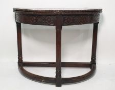 Victorian oak tea table, the semi-circular foldout top with moulded edge above blind carved