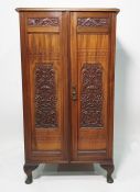Victorian walnut two-door cabinet  with moulded decoration, the doors opening to reveal linen-type