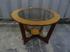 Teak G-Plan circular coffee table with glass inset top, an oblong walnut table, a two-tier tea