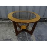 Teak G-Plan circular coffee table with glass inset top, an oblong walnut table, a two-tier tea