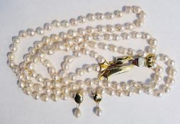 18ct gold baroque pearl two-strand necklace, 70cm long having stylised foliate 18ct gold white and