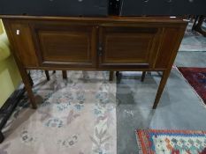 Early 20th century walnut two-door cabinet on square section tapering supports, 106.5cm x 74cm