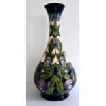 Tall Moorcroft 'Wolfsbane' vase of baluster form decorated with purple flower, marked to base '
