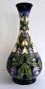 Tall Moorcroft 'Wolfsbane' vase of baluster form decorated with purple flower, marked to base '