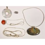 Ruskin-style silver Arts & Crafts pendant with circular red disc and a small quantity of silver