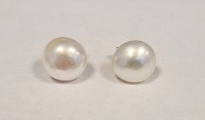 Pair of cultured pearl and gold post earrings Condition ReportOne of the pearls is approx 1.1 cm x