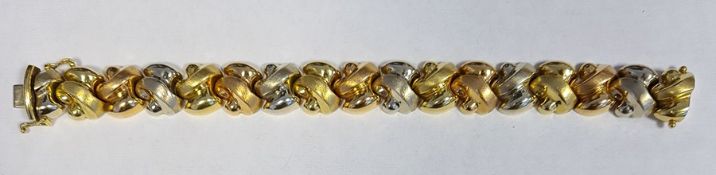 18ct gold bracelet formed of stylised and partly textured knot links alternating in colour, approx