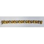 18ct gold bracelet formed of stylised and partly textured knot links alternating in colour, approx