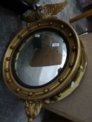 Convex wall mirror surmounted with eagle, sprayed gold with ball decoration and another circular