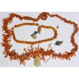 Amber-coloured bead necklace, a branch coral necklace, a small Chinese carved jade pendant and a