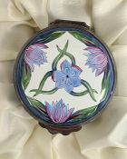 Moorcroft enamel trinket pot, cylindrical with blue cornflower and crocus decoration on a white